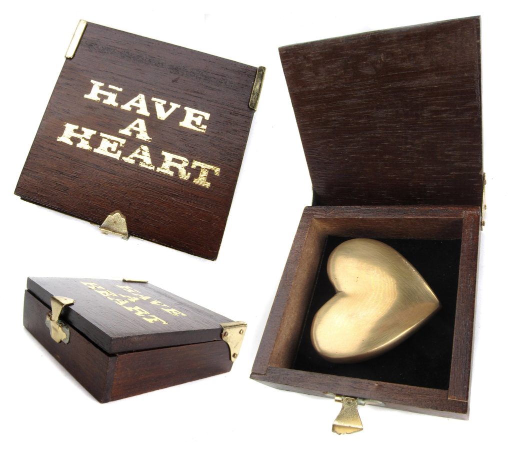 Fake Carl Auböck stained wooden box with "Have a Heart" printed in gold foil on top and brass heart shaped paperweight. With a closeup of the hinges and latches, which are similar to the originals.
