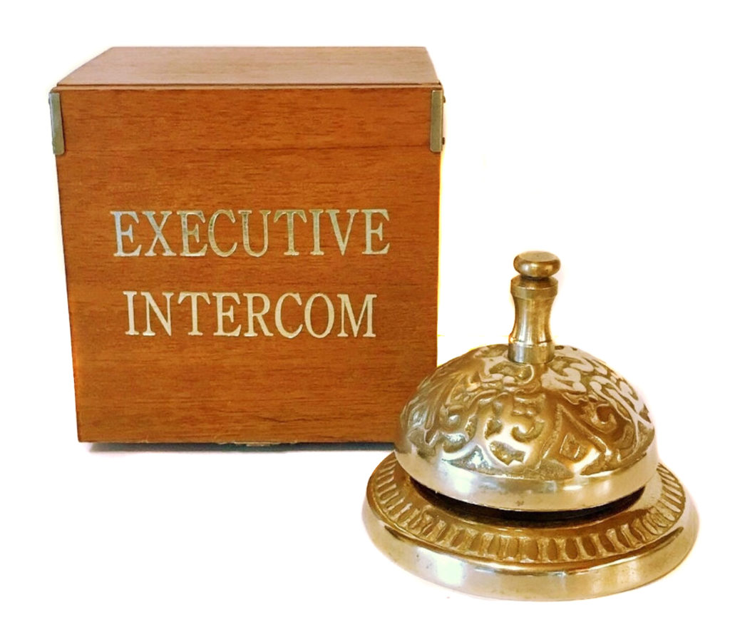 Stained wooden box with "Executive Intercom" printed in gold foil on top and a working brass service desk bell.
