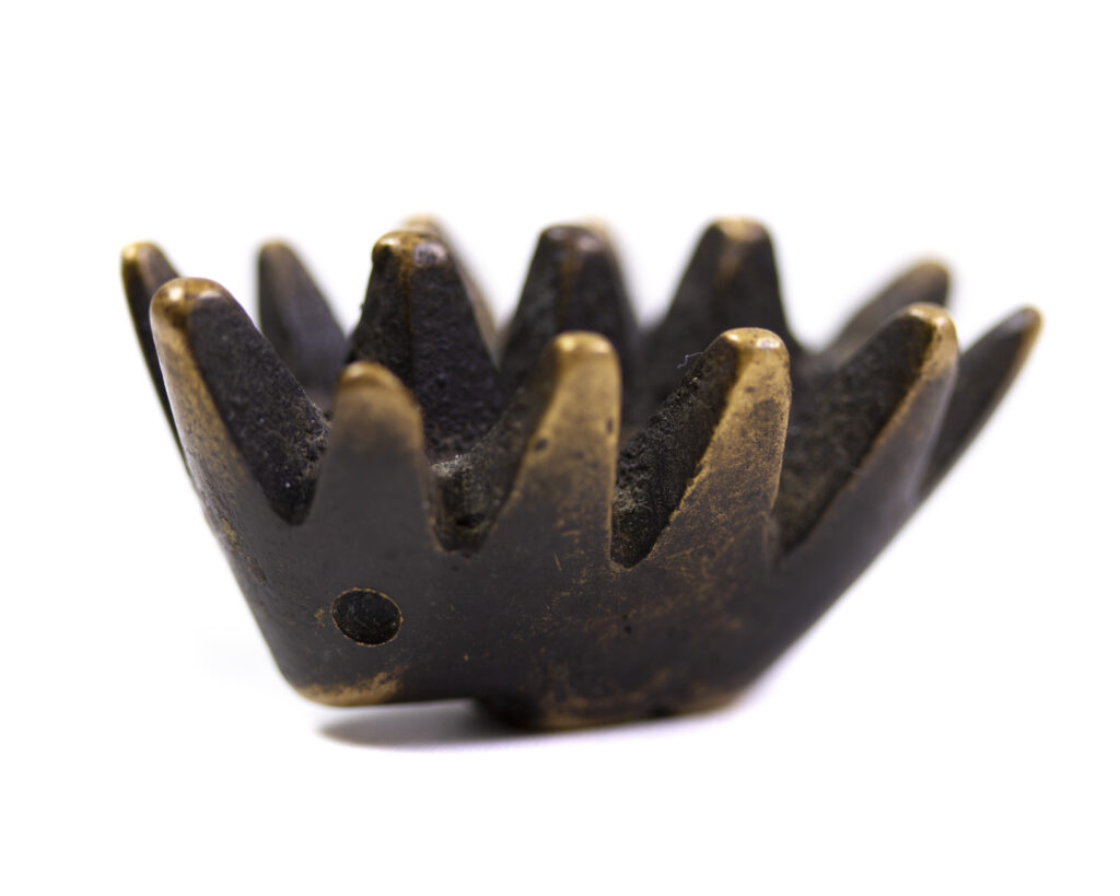 Walter Bosse vintage brass hedgehog ashtray baby with X legs with black patina and polished gold highlights